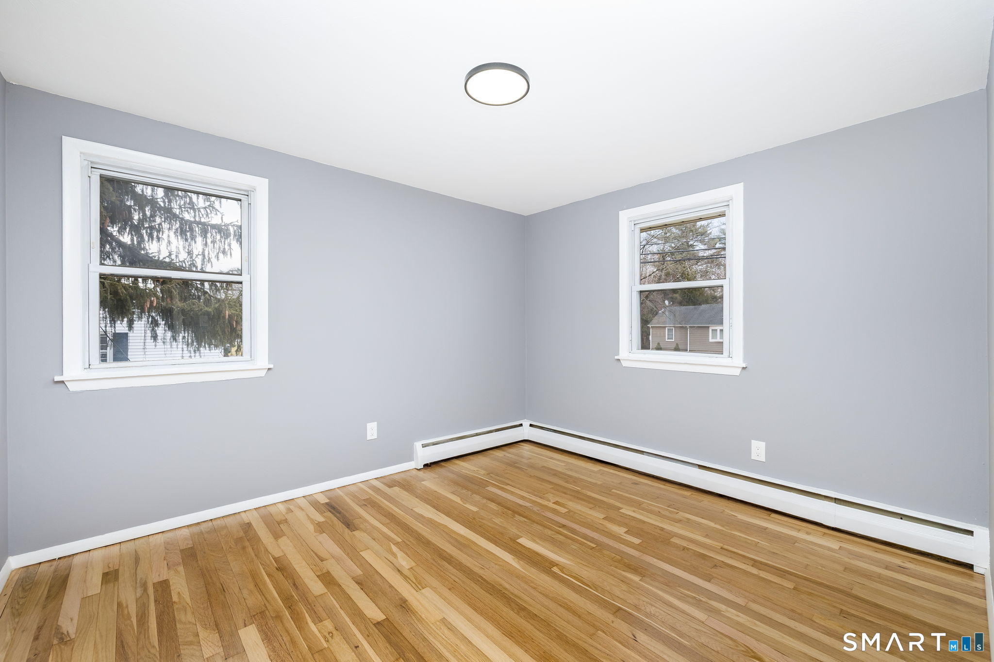 555 Graham Road South Windsor, CT 06074 - Photo 25 of 39 a view of a room with wooden floor and window