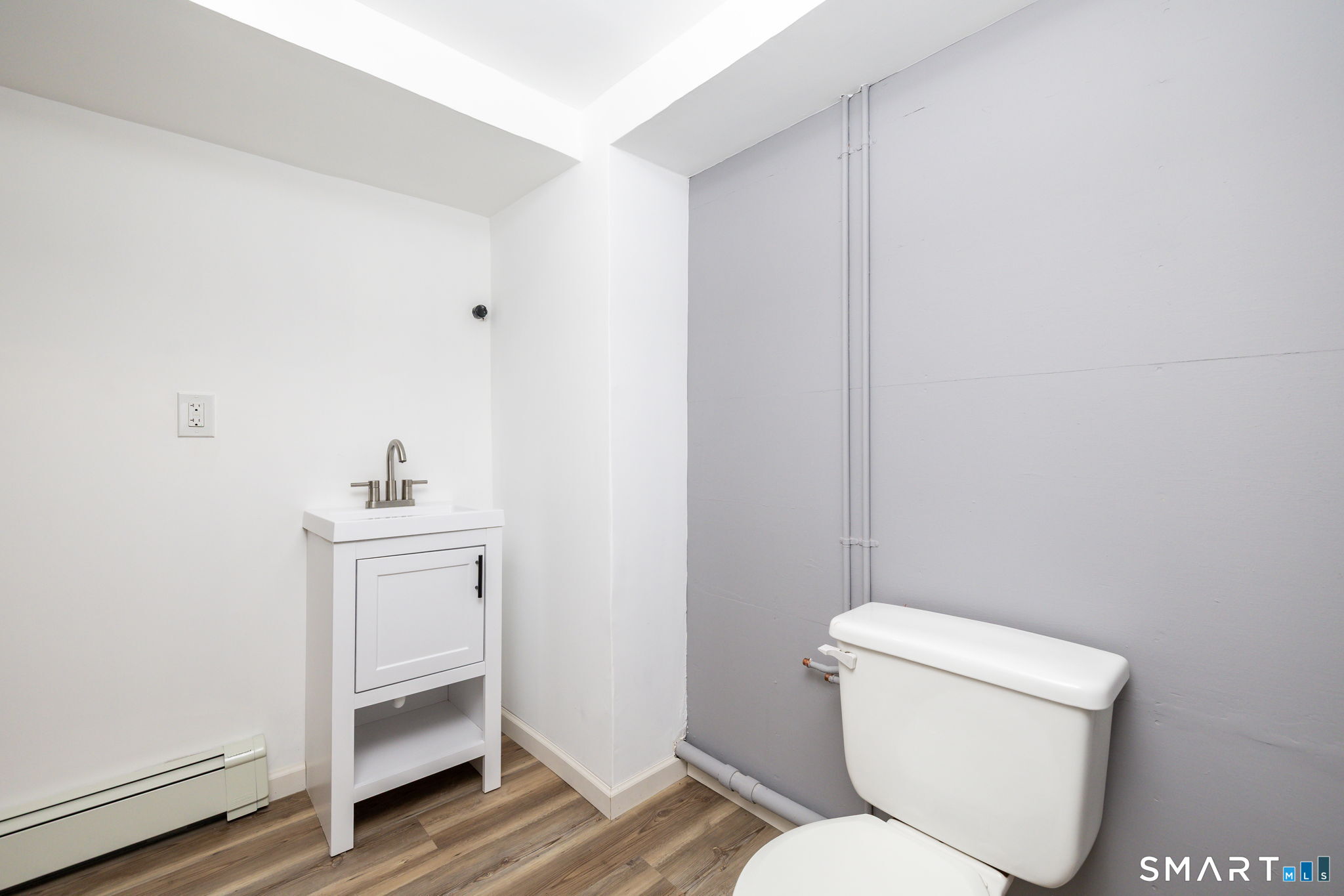 555 Graham Road South Windsor, CT 06074 - Photo 28 of 39 a bathroom with a toilet sink and vanity