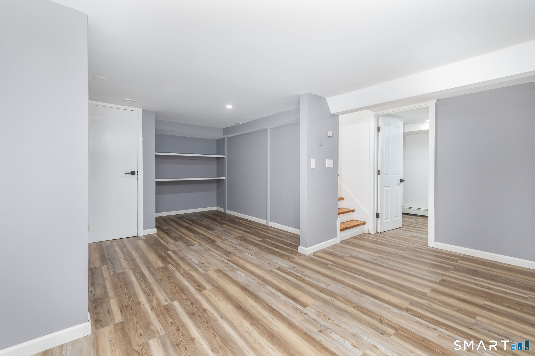 555 Graham Road South Windsor, CT 06074 - Photo 32 of 39 a view of a room with wooden floor and closet