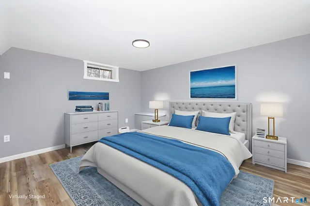 a view of an empty room with closet and a window