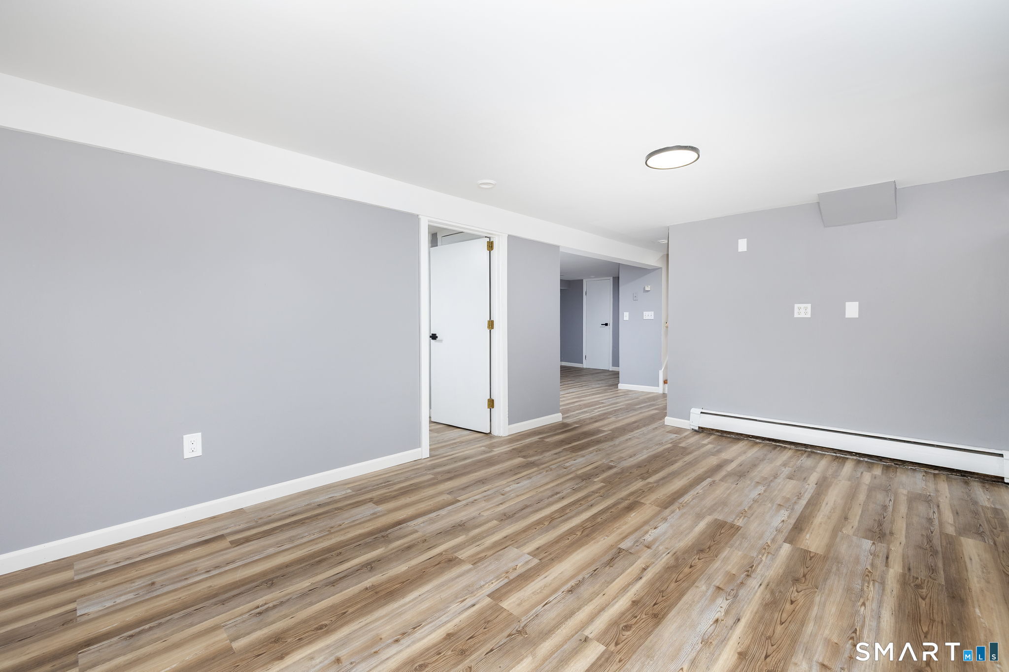 555 Graham Road South Windsor, CT 06074 - Photo 34 of 39 a view of an empty room and wooden floor