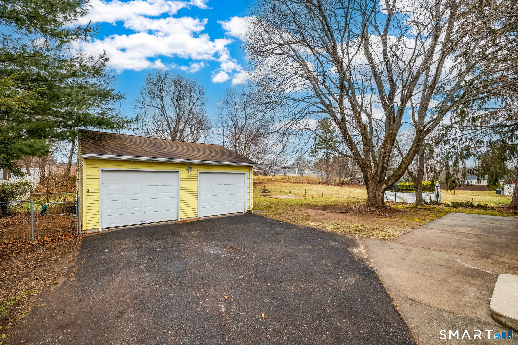 555 Graham Road South Windsor, CT 06074 - Photo 38 of 39 a view of yard with tree and wooden fence