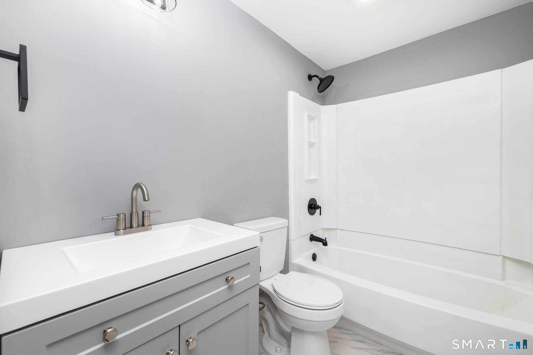 555 Graham Road South Windsor, CT 06074 - Photo 9 of 39 a bathroom with a sink a toilet and a bathtub