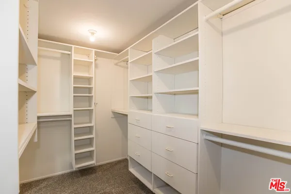 a view of an empty walk in closet