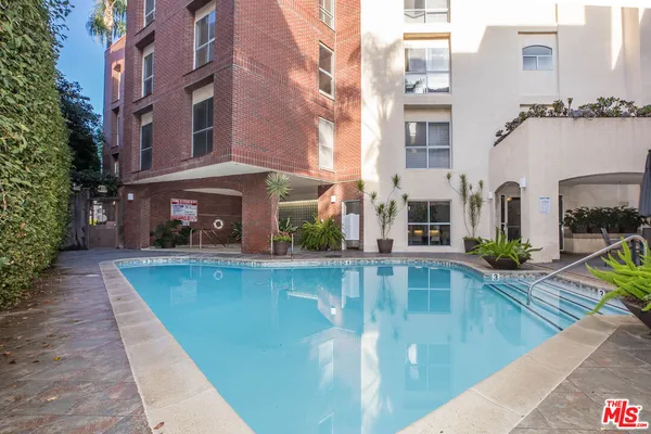 a view of a swimming pool with a patio