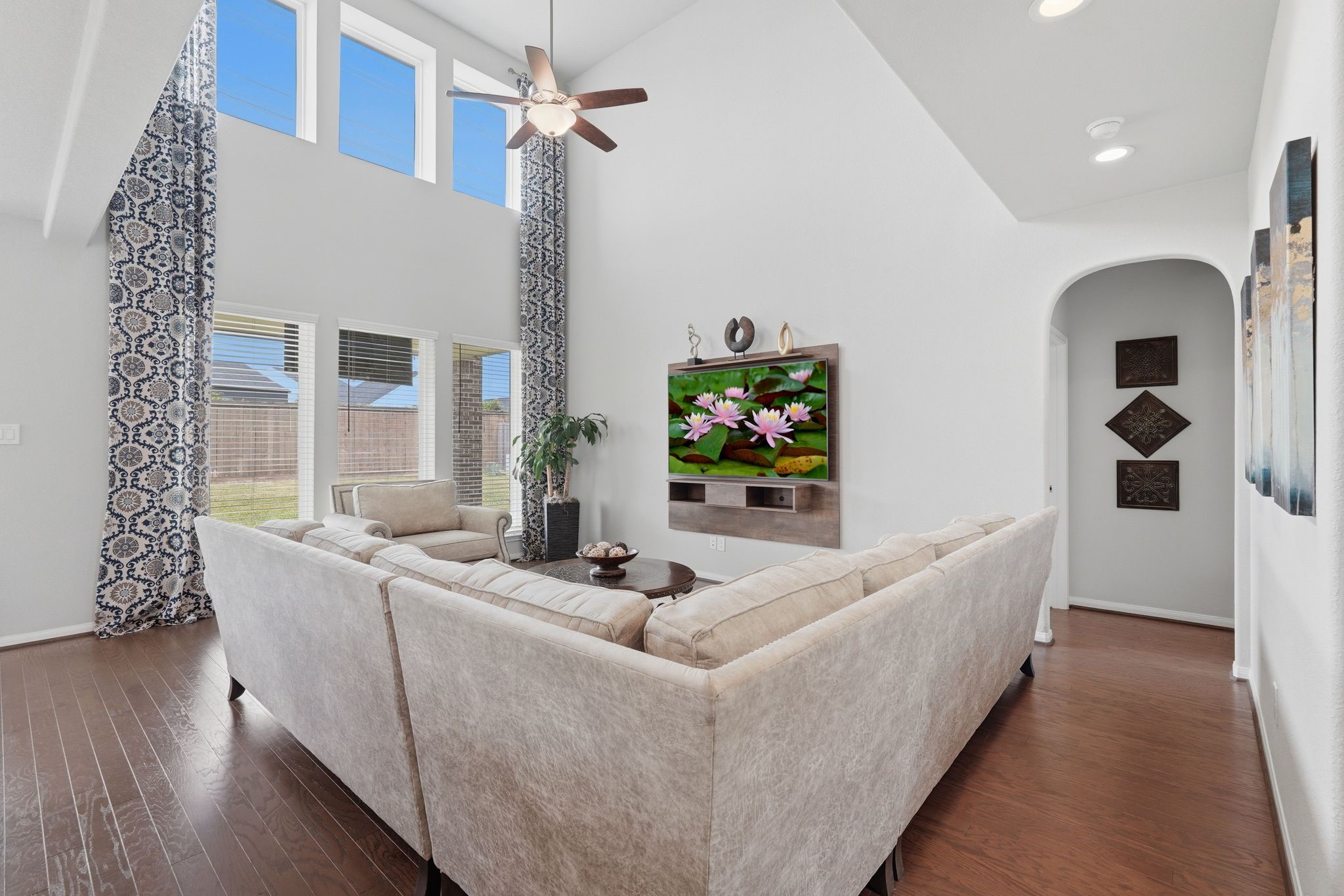 7522 Windsor View Drive Spring, TX 77379 - Photo 8 of 49 Light-filled living space with tall ceilings and peaceful views of the backyard.