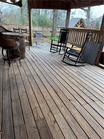a view of balcony with wooden floor