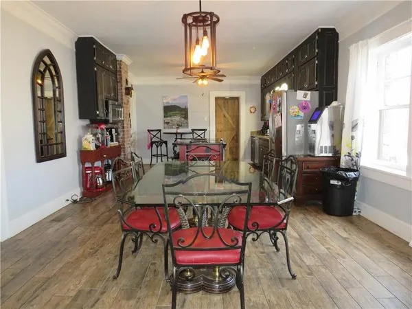 a kitchen with stainless steel appliances granite countertop a stove sink and cabinets