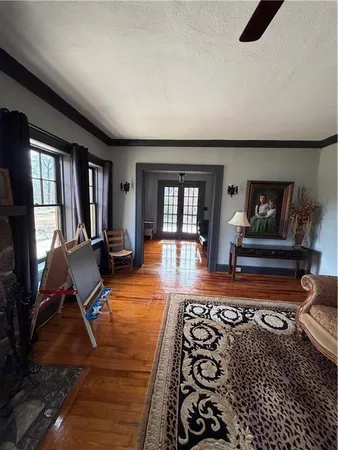 a view of a room with wooden floor and chair