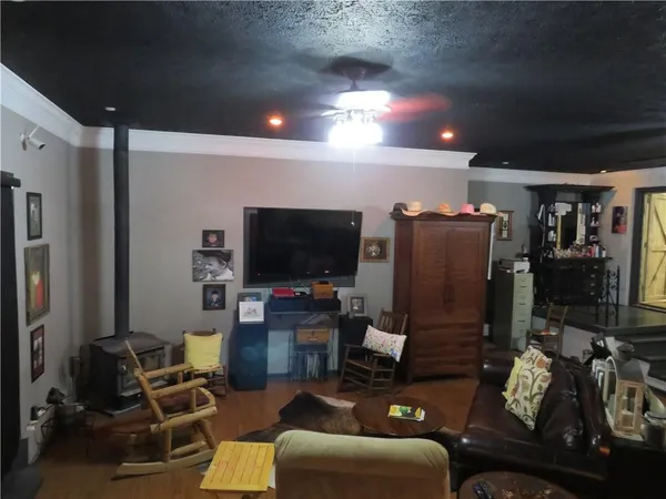 a room with furniture and a flat screen tv
