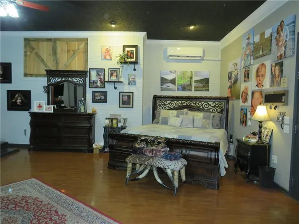 a room with furniture and a flat screen tv