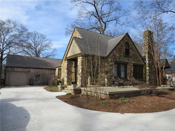 a view of house with backyard