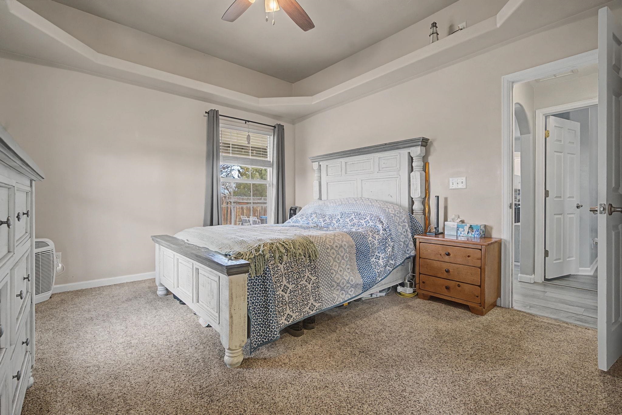 3055 E Road Grand Junction, CO 81504 - Photo 15 of 32 a bed room with a bed and a couch