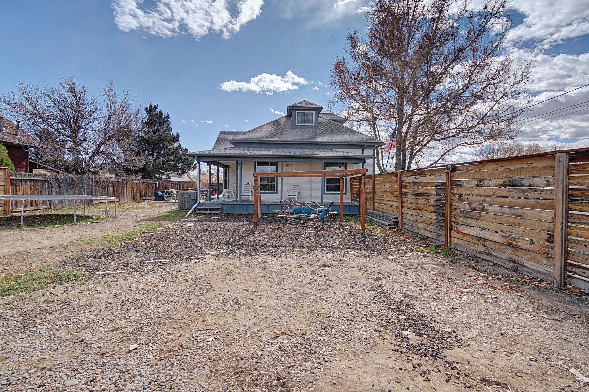 3055 E Road Grand Junction, CO 81504 - Photo 2 of 32 a front view of a house with garden