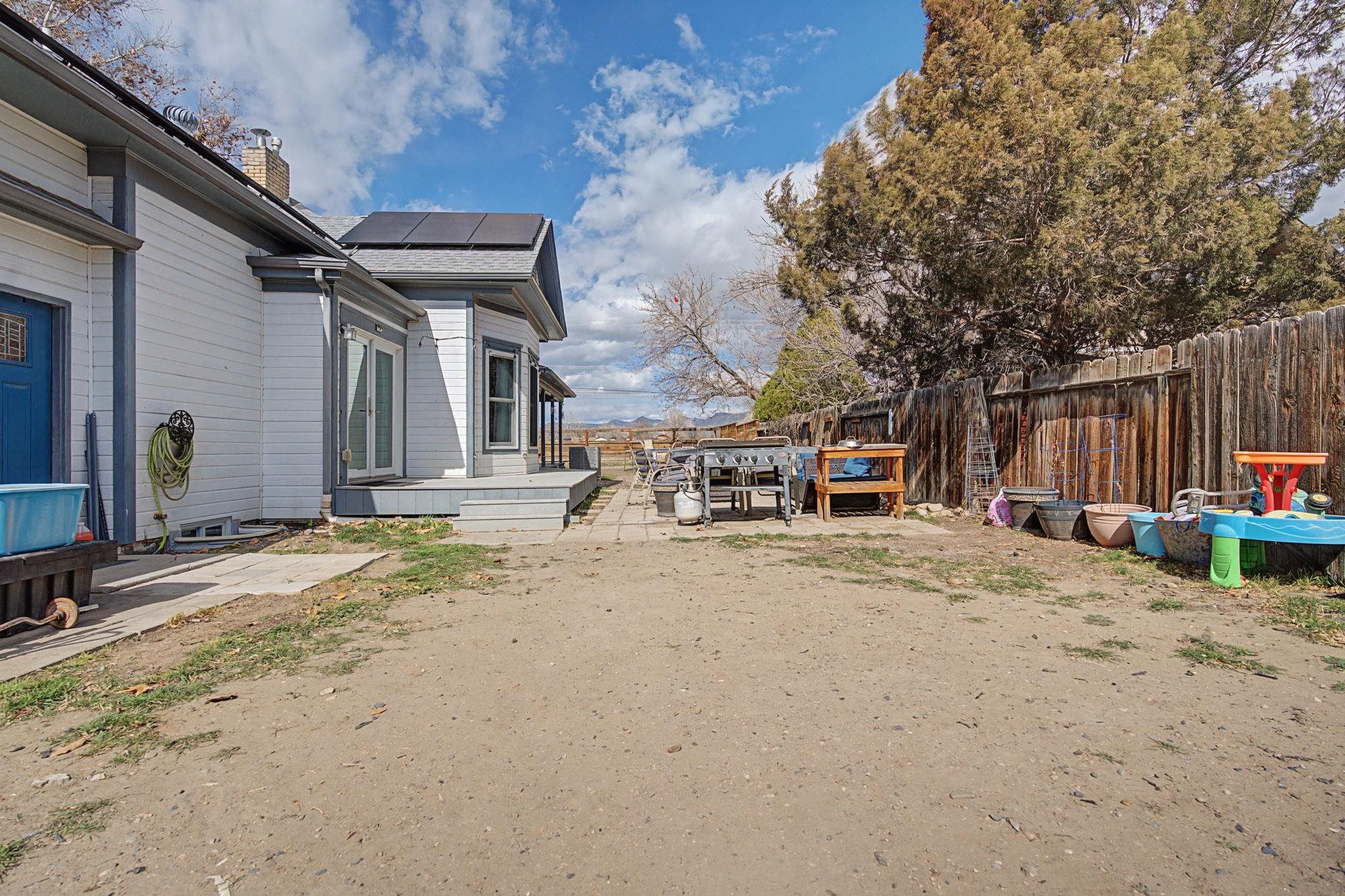 3055 E Road Grand Junction, CO 81504 - Photo 24 of 32 a view of the house with backyard and sitting area
