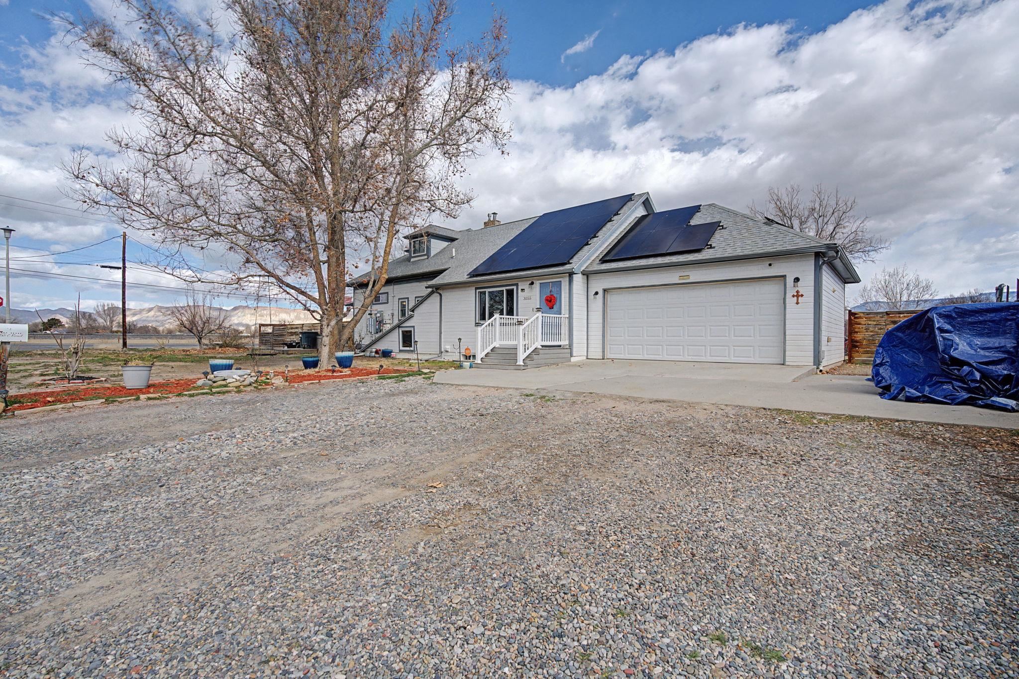 3055 E Road Grand Junction, CO 81504 - Photo 27 of 32 a view of road with large trees