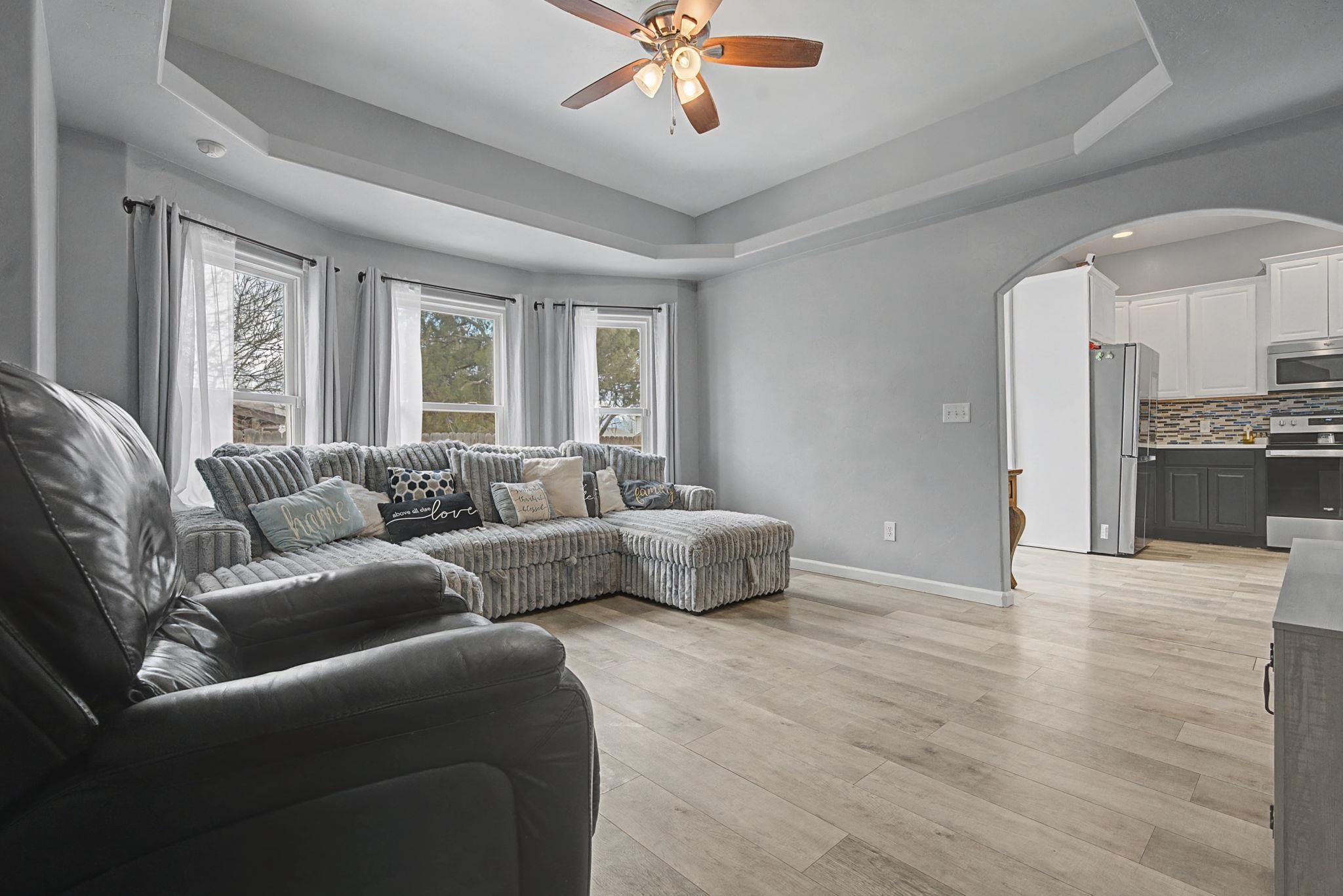 3055 E Road Grand Junction, CO 81504 - Photo 9 of 32 a living room with furniture and a large window