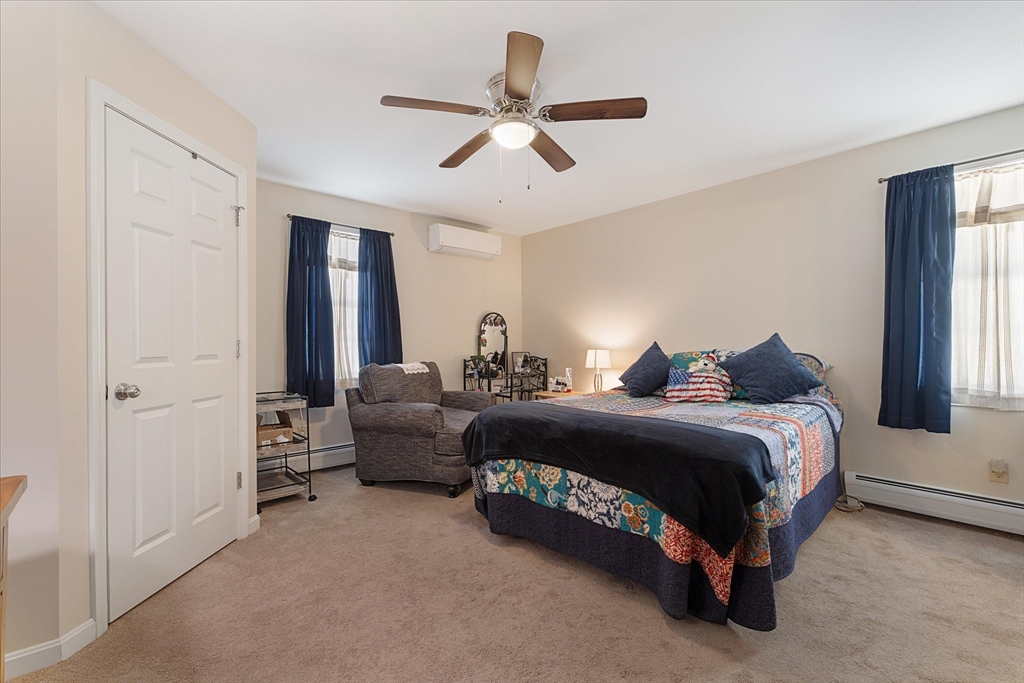 77 Old Keene Road Athol, MA 01331 - Photo 14 of 31 a spacious bedroom with a bed and window