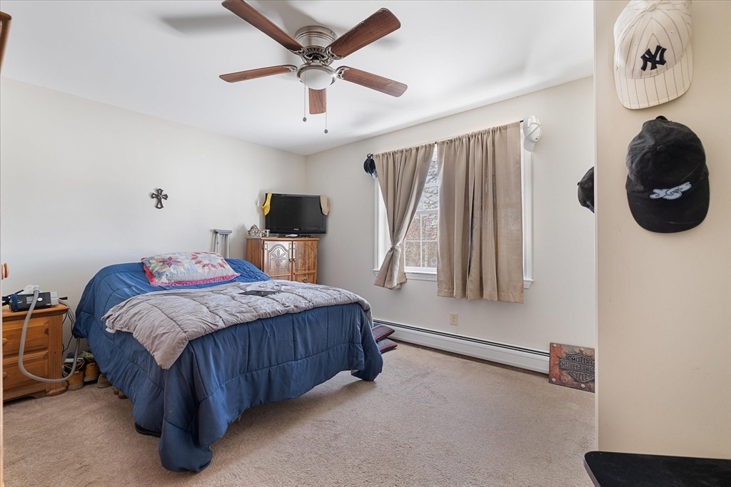 77 Old Keene Road Athol, MA 01331 - Photo 19 of 31 a bedroom with a large bed and a window