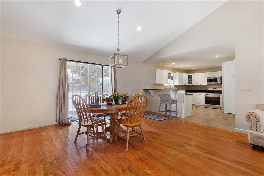 77 Old Keene Road Athol, MA 01331 - Photo 7 of 31 a dining room with furniture a chandelier and wooden floor