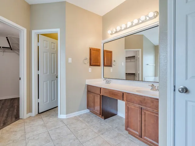 a spacious bathroom with bathtub and shower
