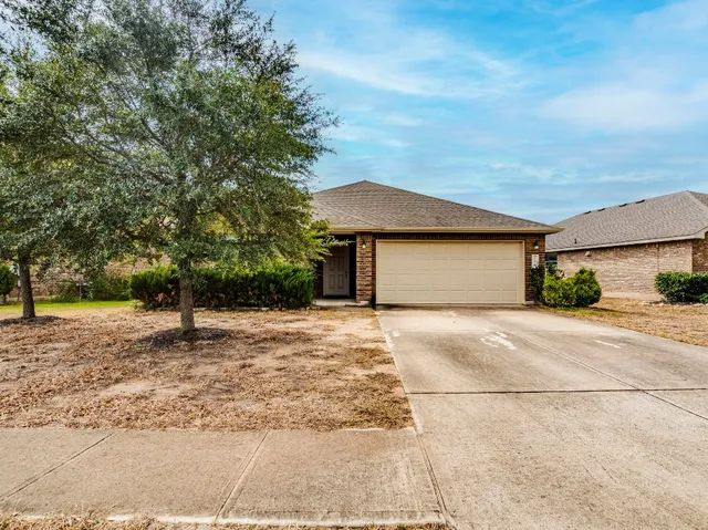 a kitchen with stainless steel appliances granite countertop a sink refrigerator and microwave