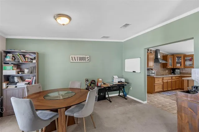 a view of a dining room with furniture