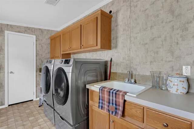 a view of a kitchen with washer and dryer