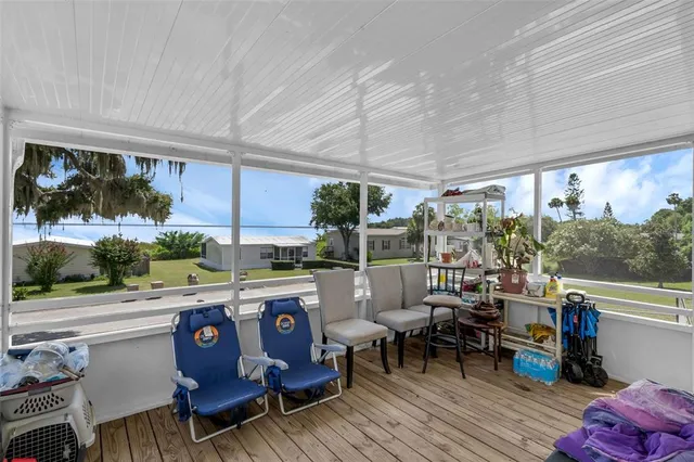 a room with lots of furniture a desk and chair