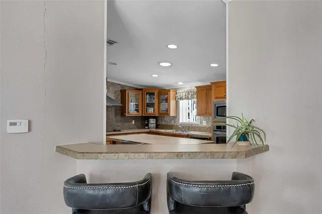 a kitchen with a stove and a sink