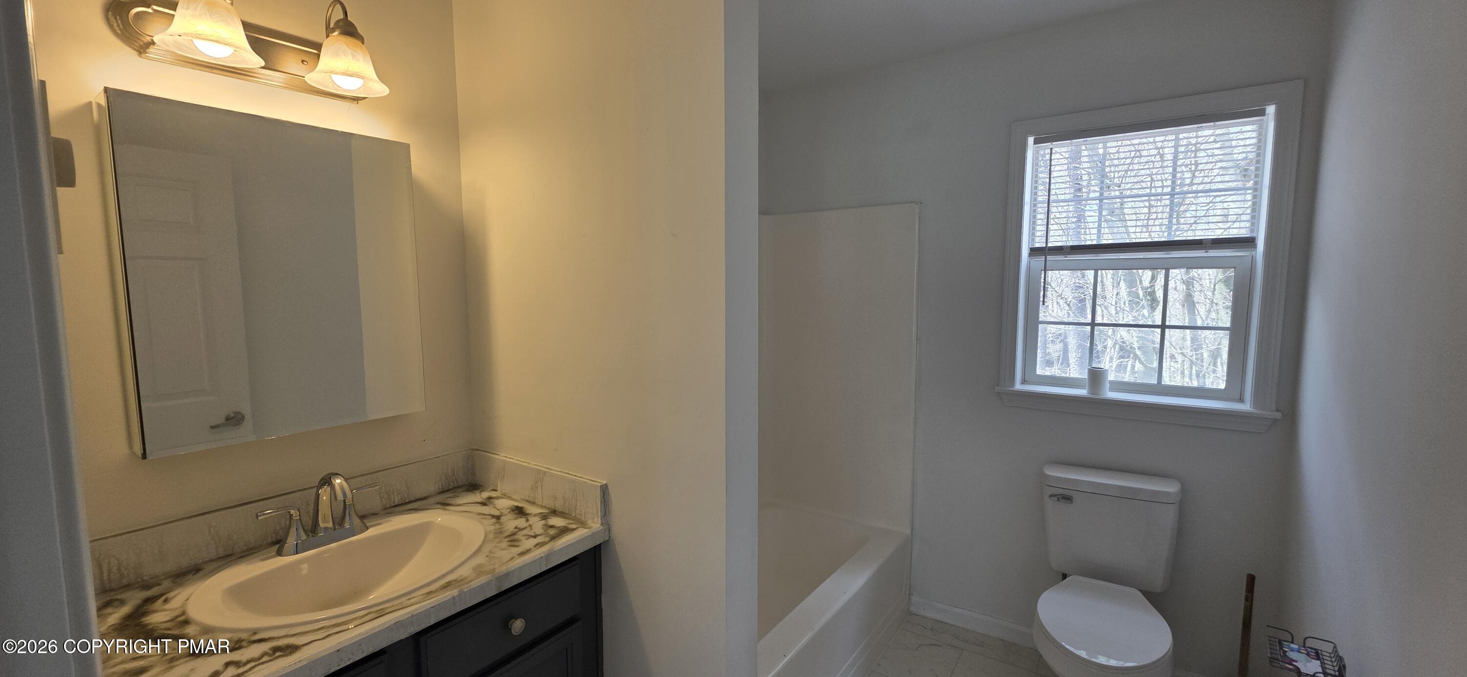 4715 Norwood Lane Tobyhanna, PA 18466 - Photo 12 of 14 a bathroom with a granite countertop sink toilet and mirror