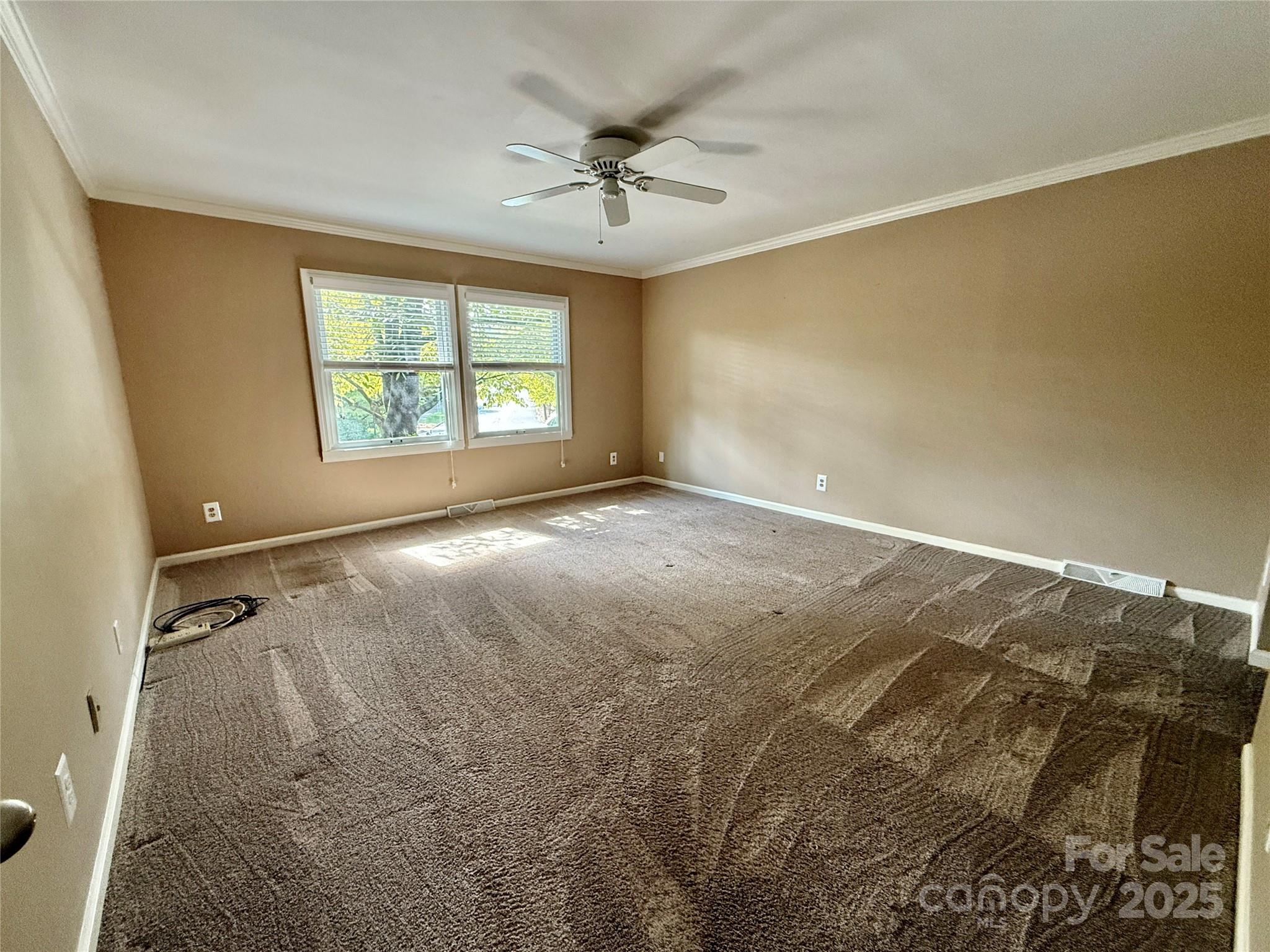 77 Chestnut Street, Unit 103 Tryon, NC 28782 - Photo 14 of 17 a view of a room with a window and ceiling fan