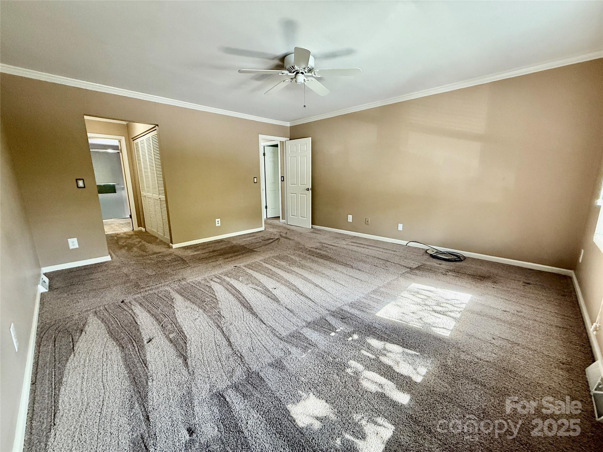 77 Chestnut Street, Unit 103 Tryon, NC 28782 - Photo 15 of 17 a view of a room with a ceiling fan