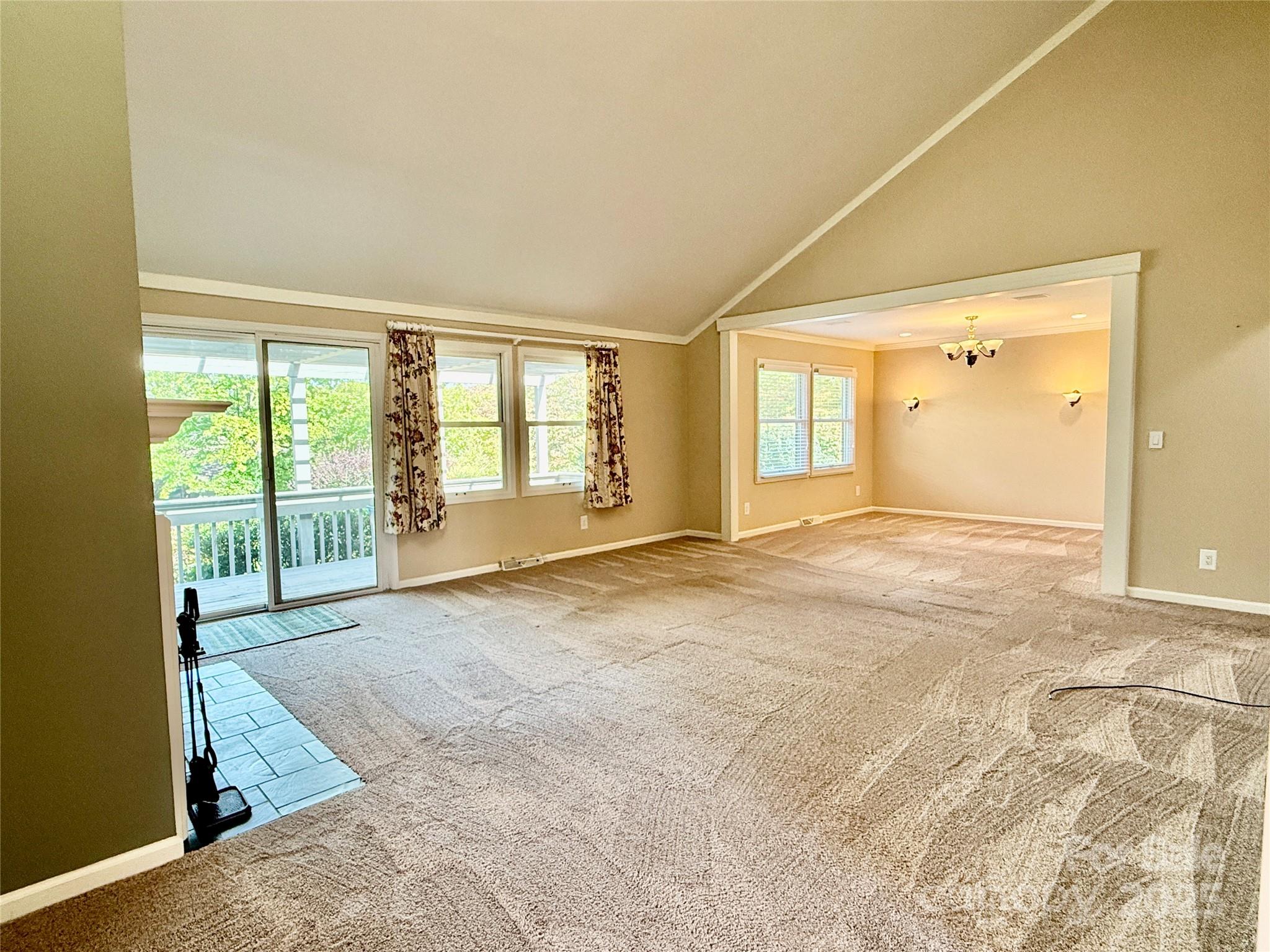 77 Chestnut Street, Unit 103 Tryon, NC 28782 - Photo 3 of 17 an empty room with large windows