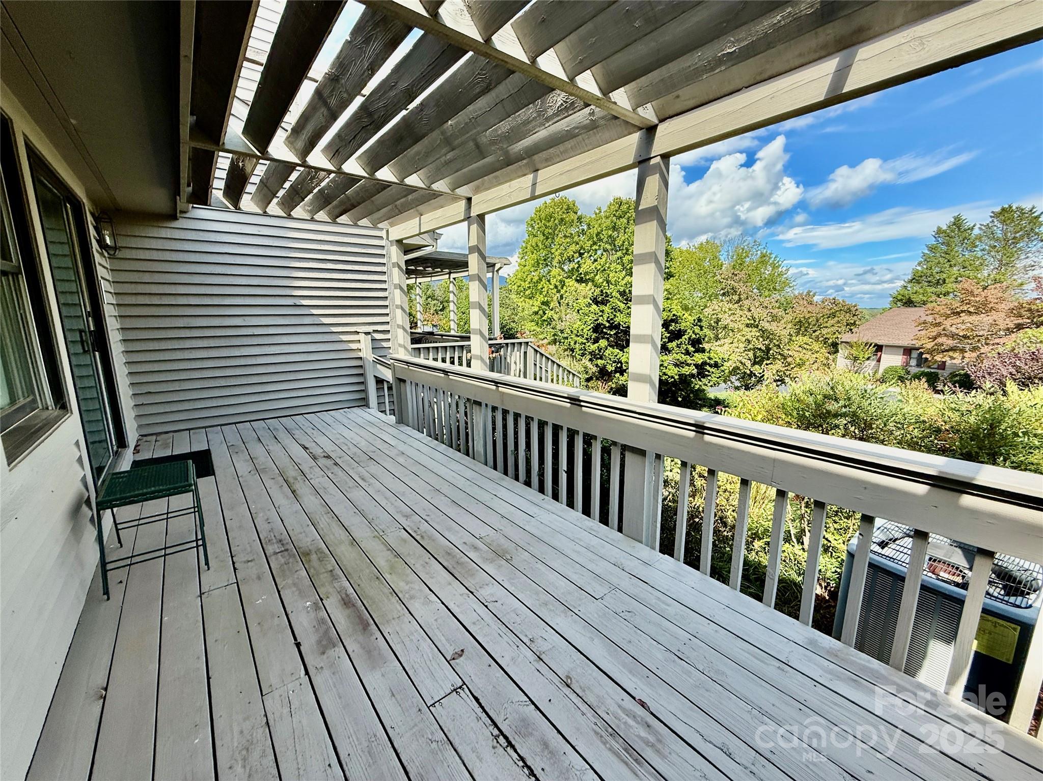 77 Chestnut Street, Unit 103 Tryon, NC 28782 - Photo 6 of 17 a view of balcony with wooden floor