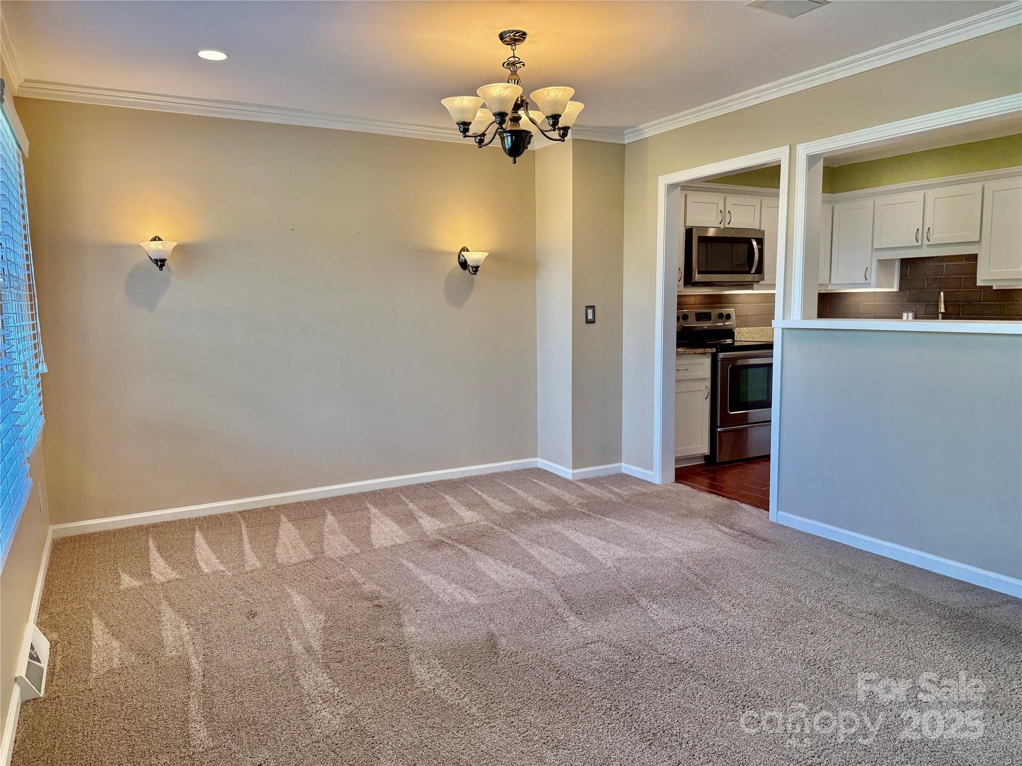 77 Chestnut Street, Unit 103 Tryon, NC 28782 - Photo 8 of 17 a view of a kitchen with a sink and refrigerator