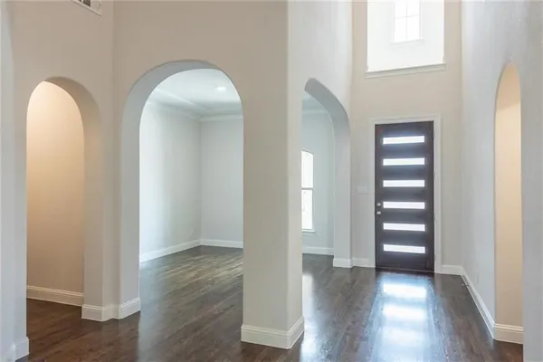 a view of entryway with wooden floor