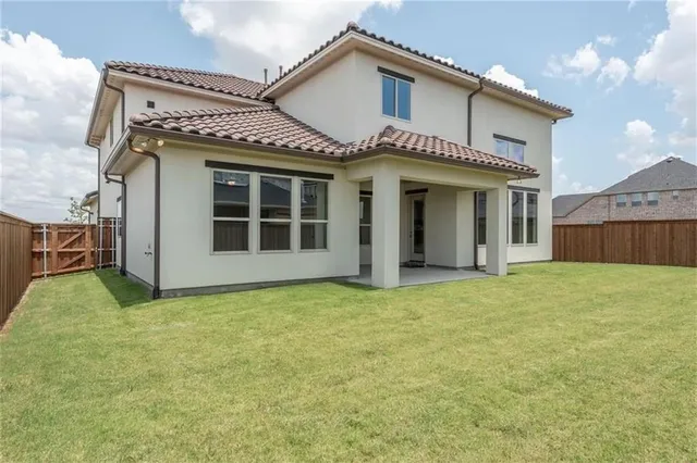a view of a house with wooden floor and a large window
