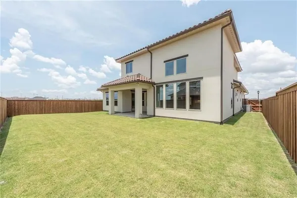 a house view with swimming pool and wooden fence