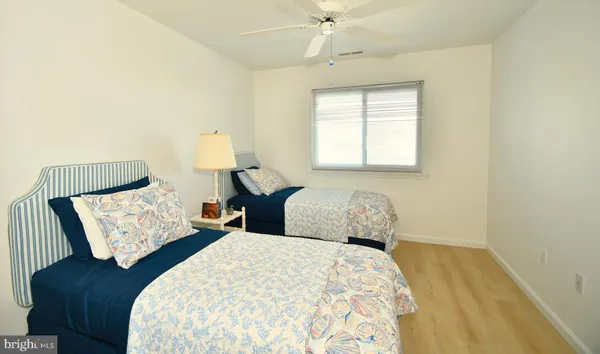 a bedroom with bed and window