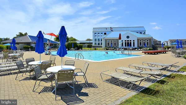 a front view of building with outdoor seating