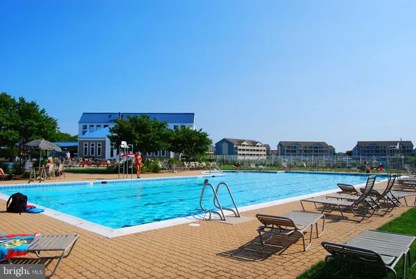 a view of a swimming pool with seating area