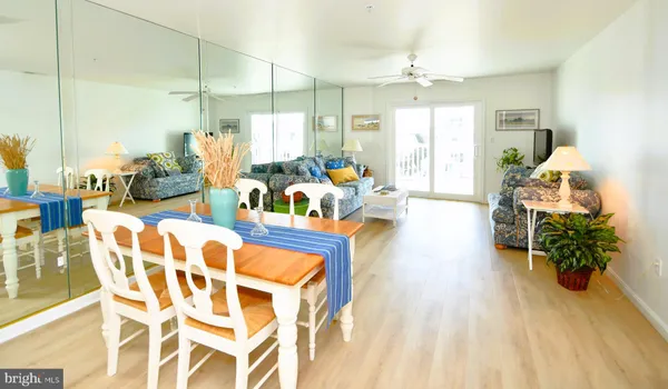a very nice looking living room with a large window and furniture