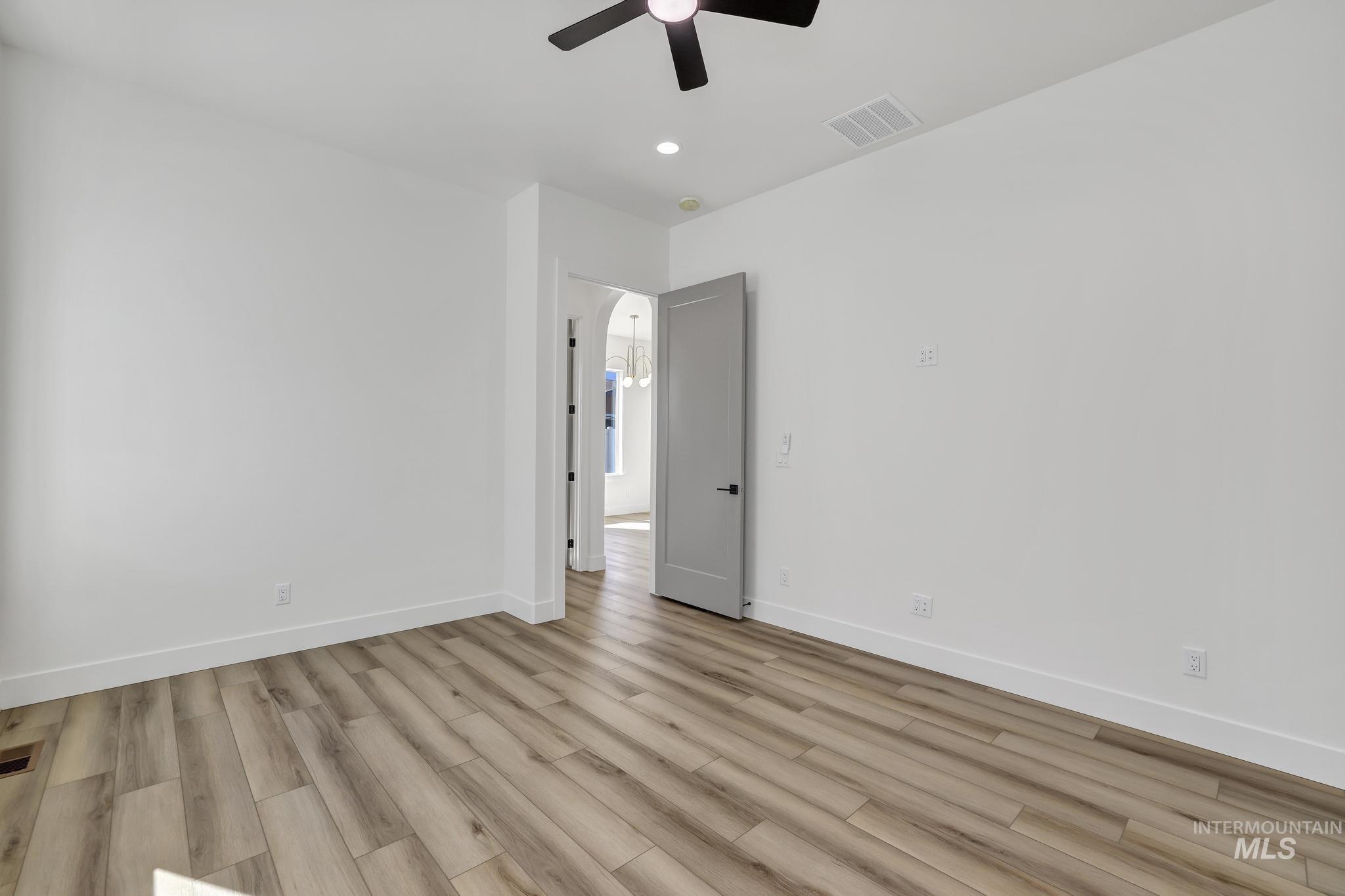 521 Falling Leaf Lane Twin Falls, ID 83301 - Photo 29 of 42 Empty room with light wood-type flooring, recessed lighting, and ceiling fan