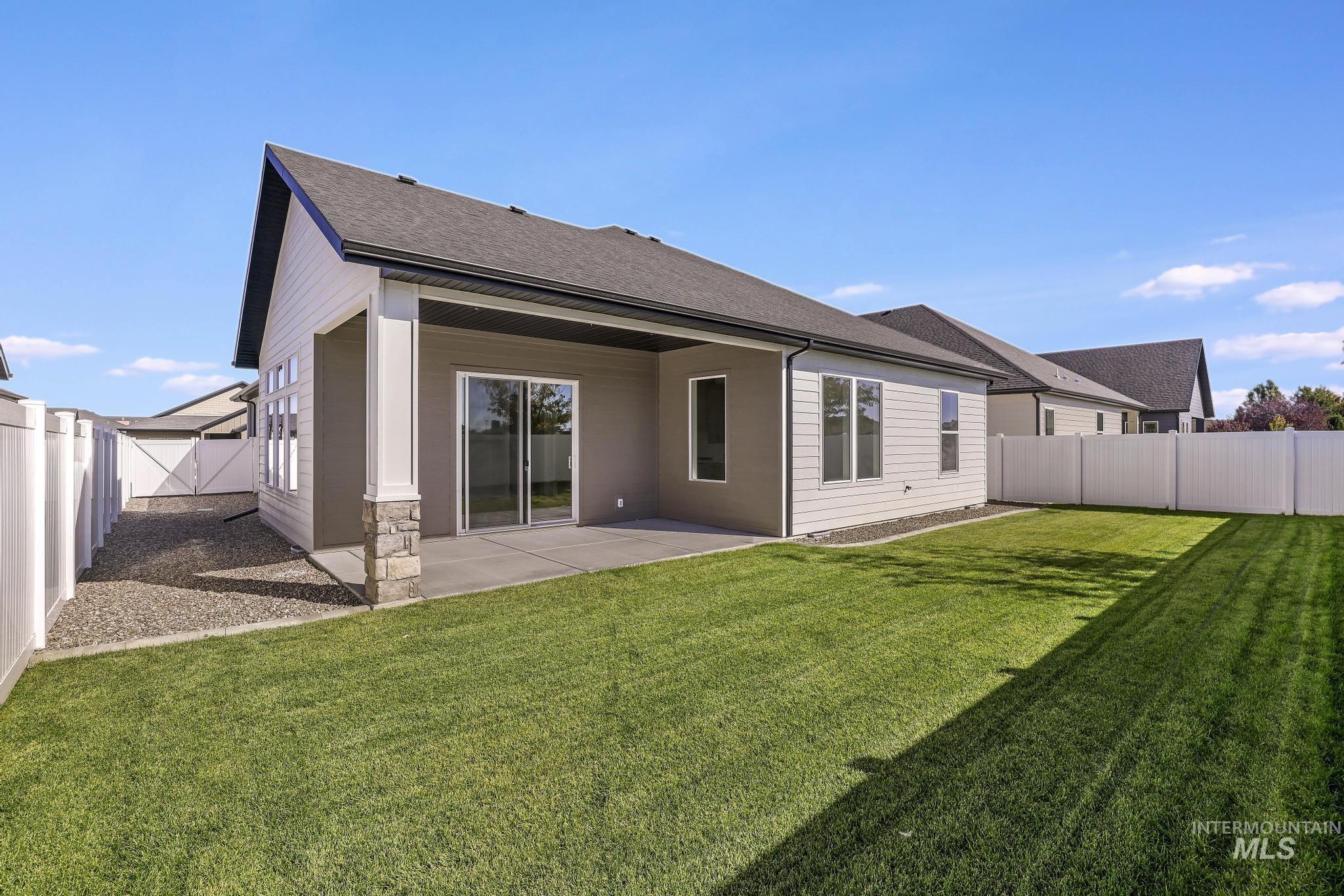 521 Falling Leaf Lane Twin Falls, ID 83301 - Photo 35 of 42 Rear view of property with a fenced backyard, a patio area, and roof with shingles