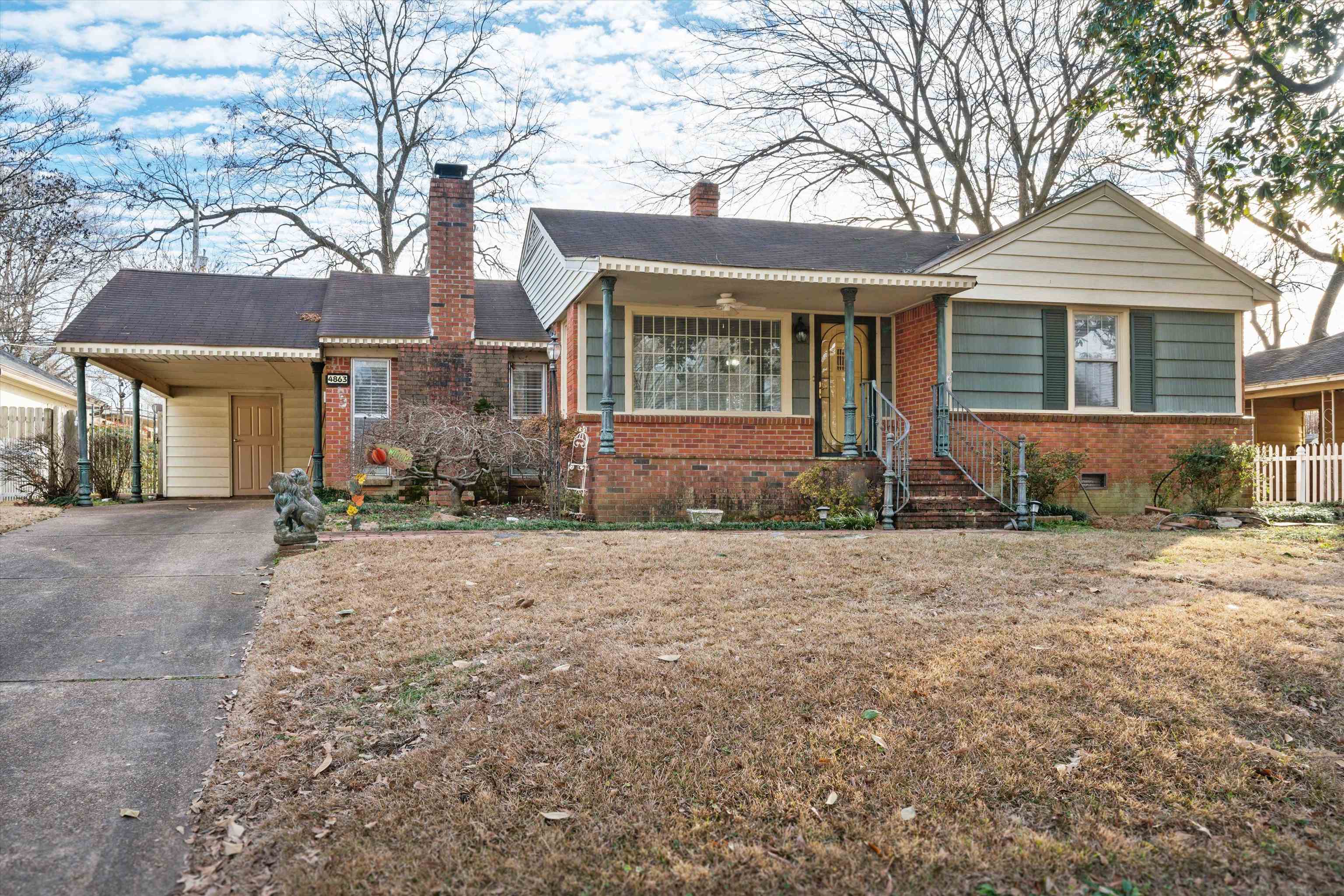 4863 Amboy Road Memphis, TN 38117 - Photo 1 of 26 a front view of a house with garden