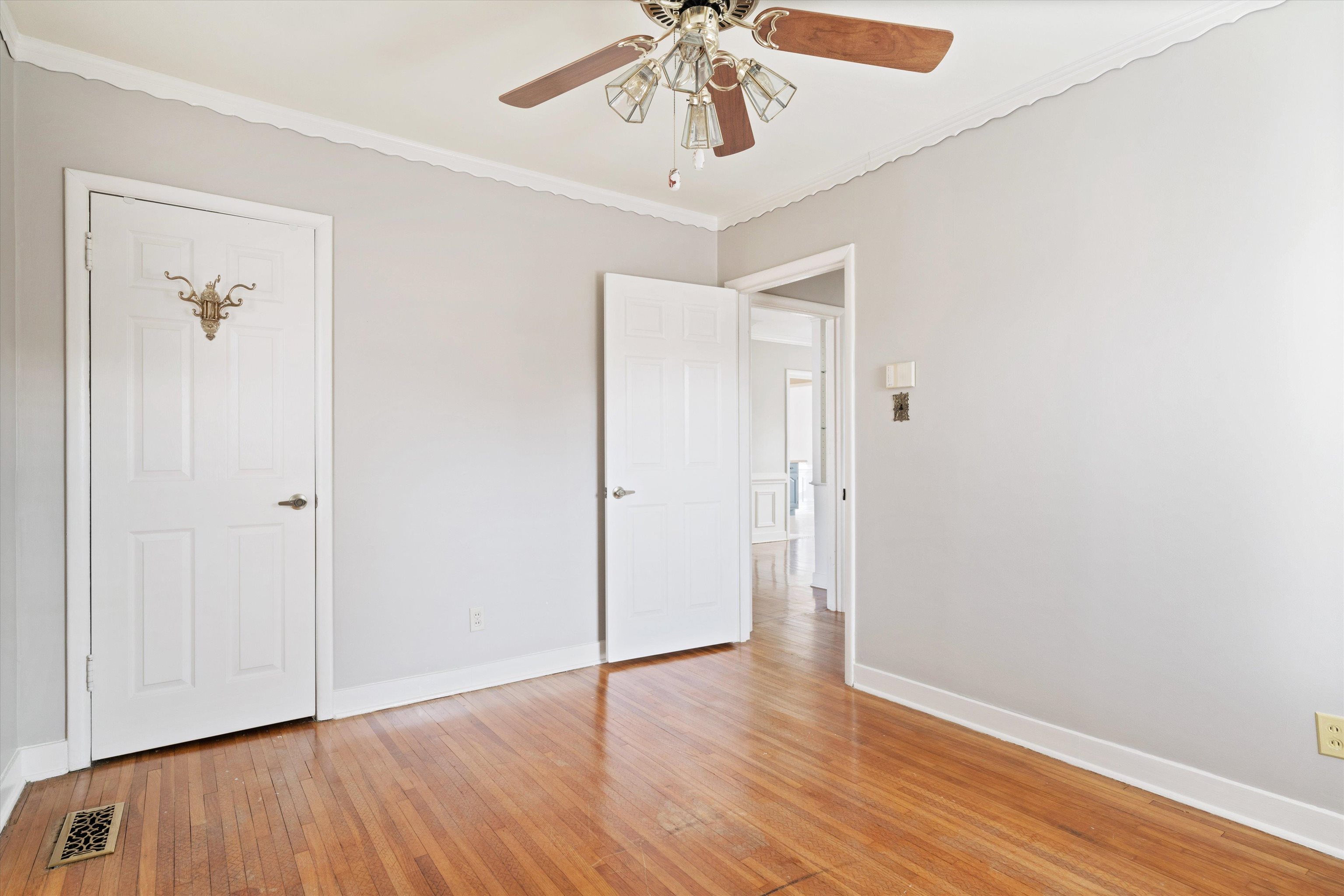 4863 Amboy Road Memphis, TN 38117 - Photo 16 of 26 an empty room with wooden floor closet and windows