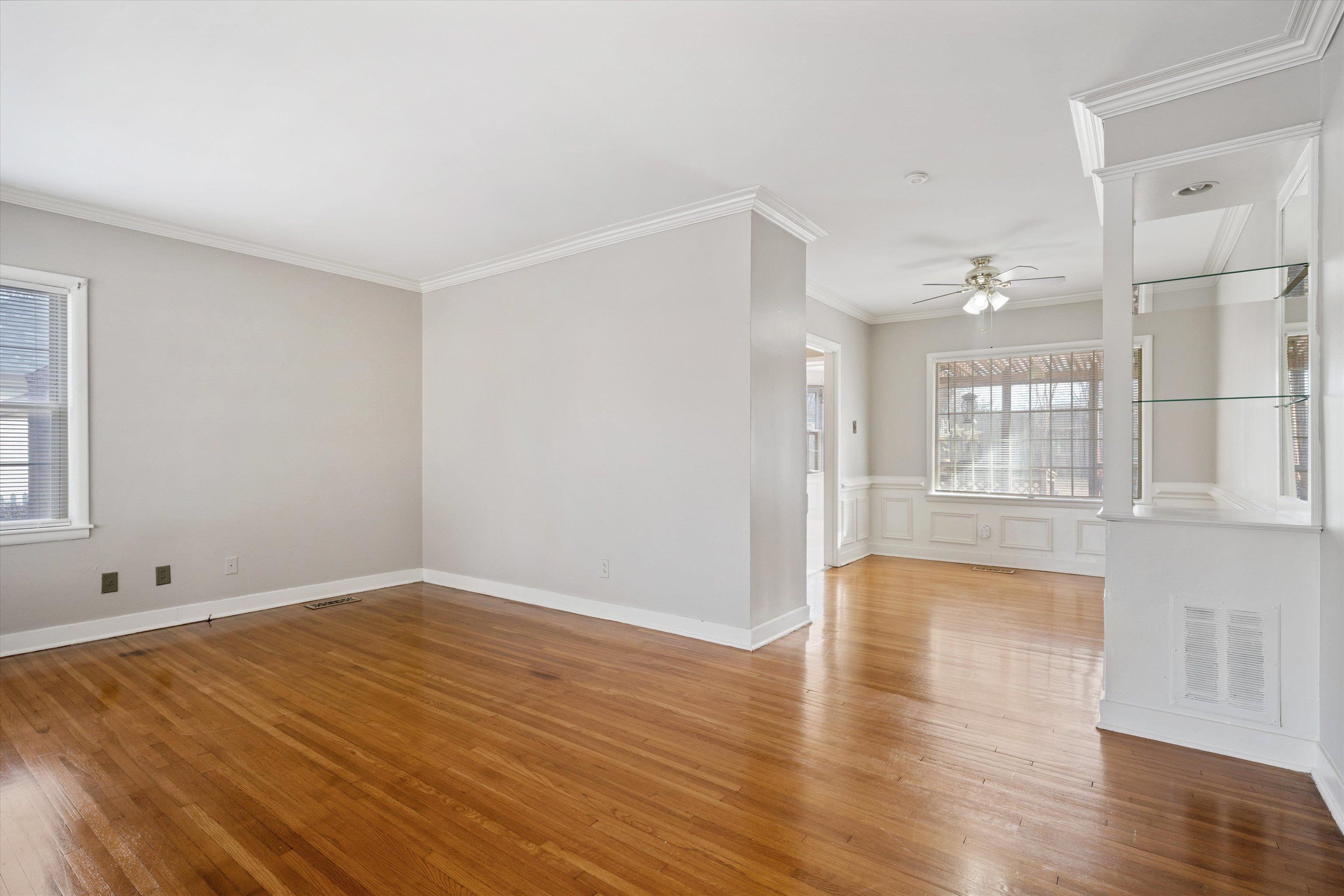 4863 Amboy Road Memphis, TN 38117 - Photo 3 of 26 wooden floor in an empty room with a window