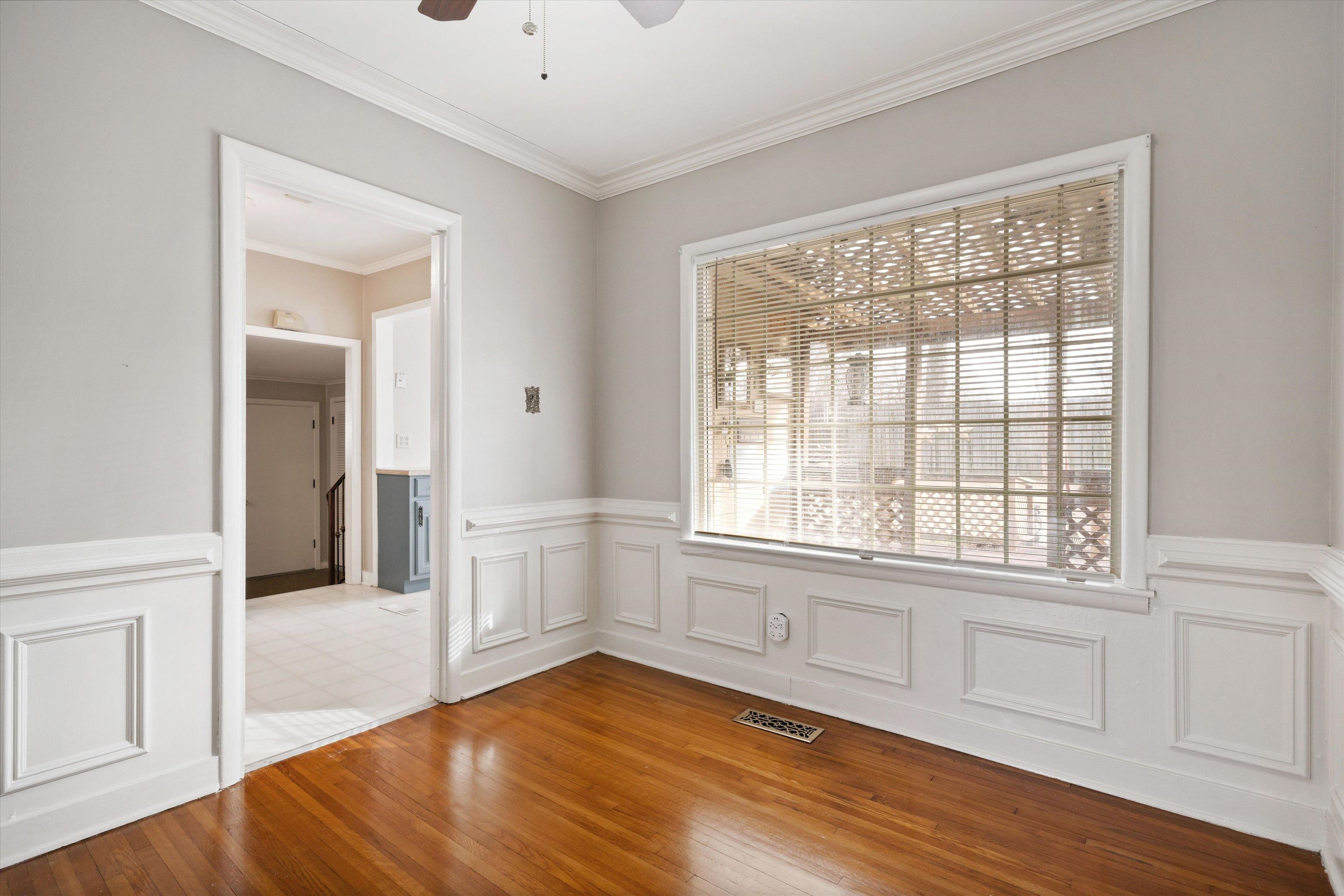 4863 Amboy Road Memphis, TN 38117 - Photo 8 of 26 wooden floor in an empty room with a window