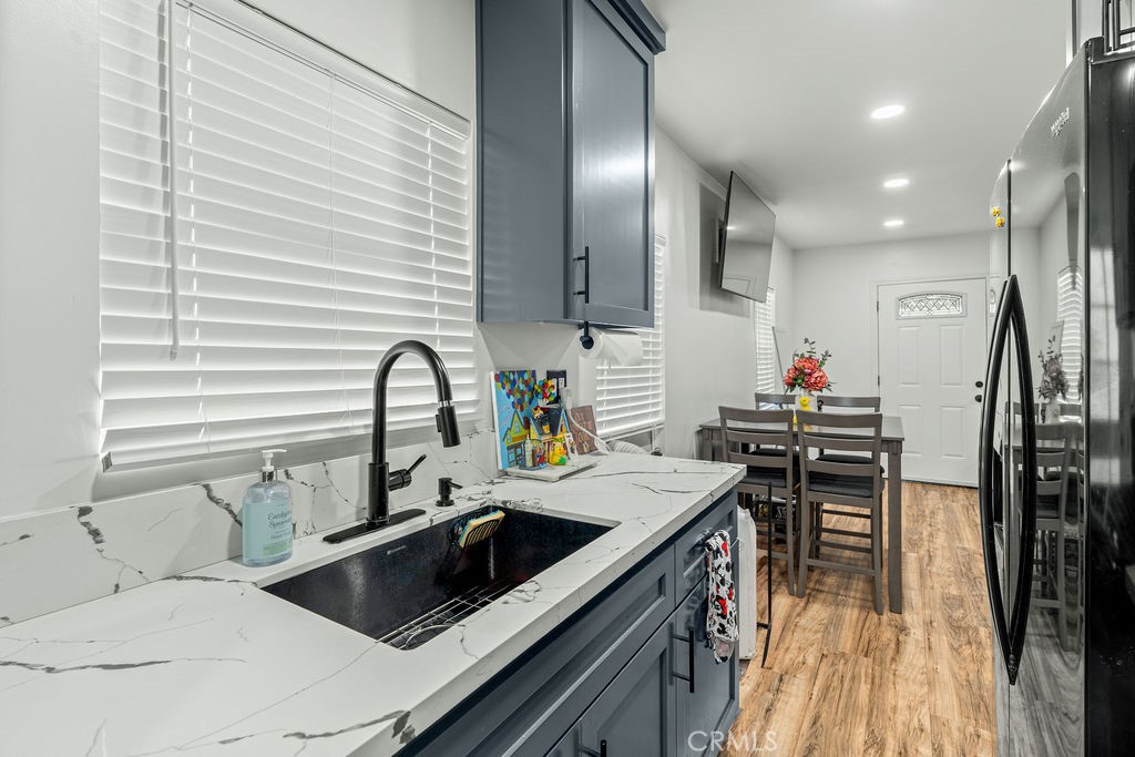 2015 Wayside Street Compton, CA 90222 - Photo 12 of 27 a kitchen with a sink appliances and cabinets